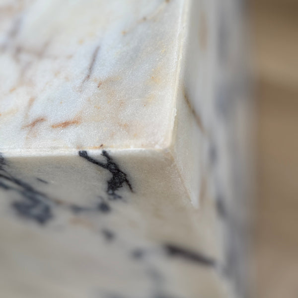 Close-up of a marble countertop with a blurred background